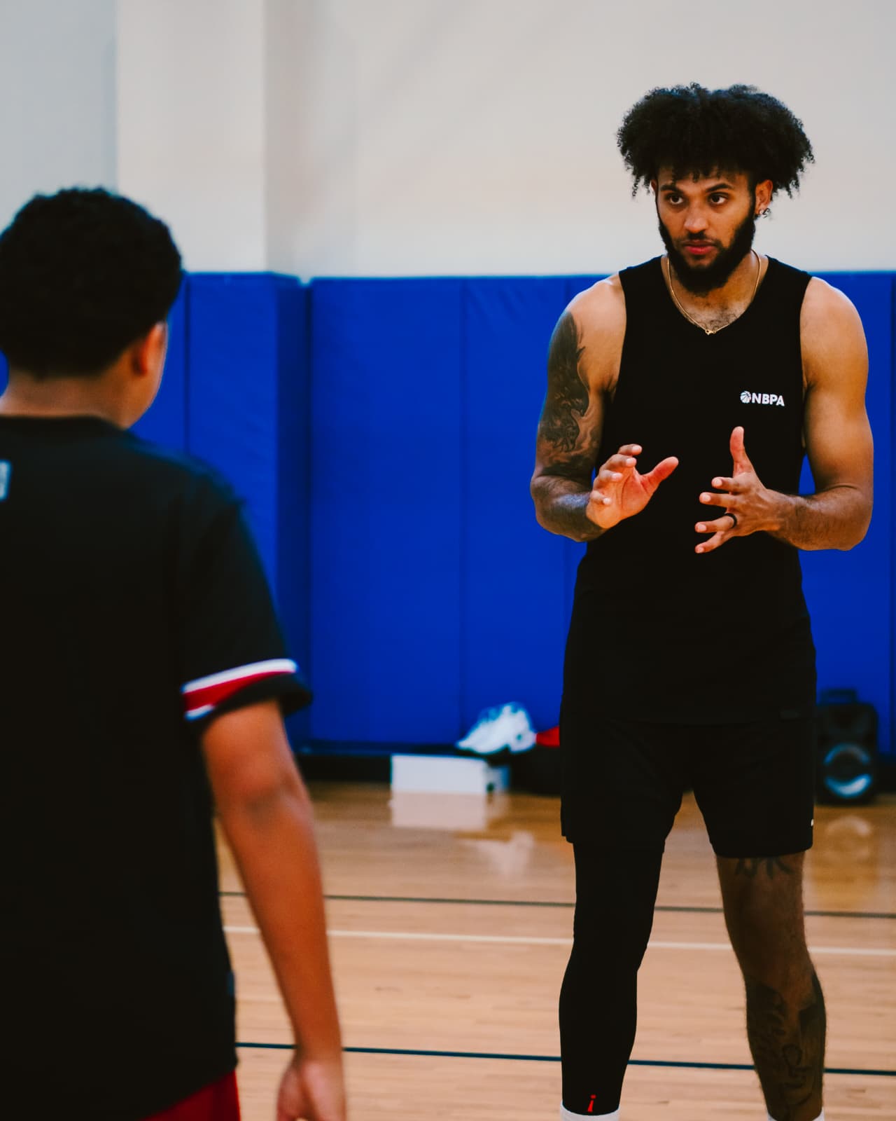 Coach leading a defensive drill at the Hanging with the Pros event
